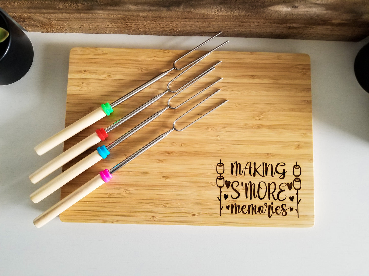 Bamboo S'mores board with 4 forks for marshmallows.  Bamboo wood laser engraved cutting board.