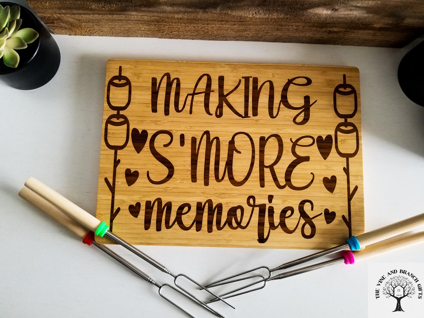 Bamboo S'mores board with 4 forks for marshmallows.  Bamboo wood laser engraved cutting board.