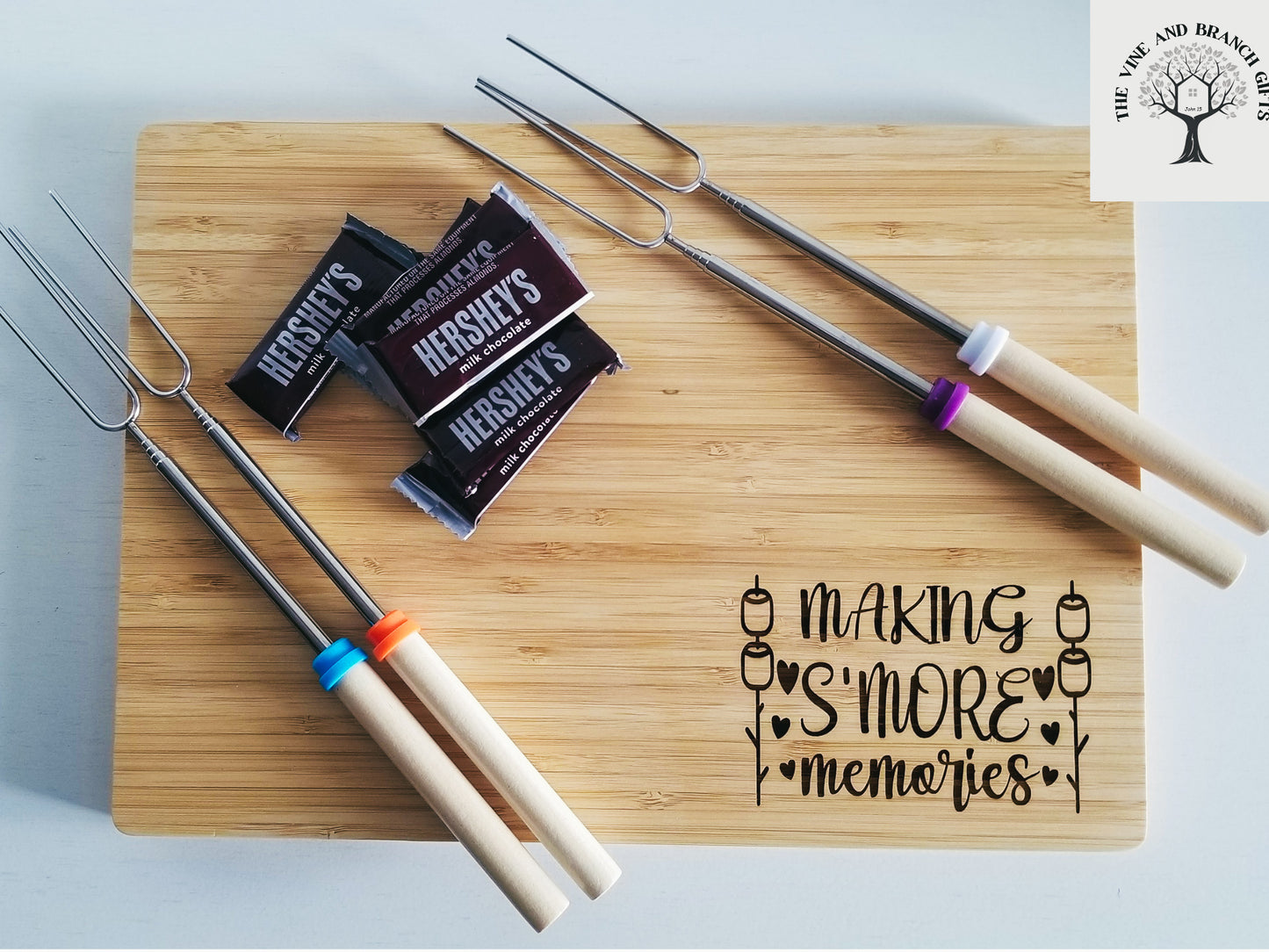 Bamboo S'mores board with 4 forks for marshmallows.  Bamboo wood laser engraved cutting board.