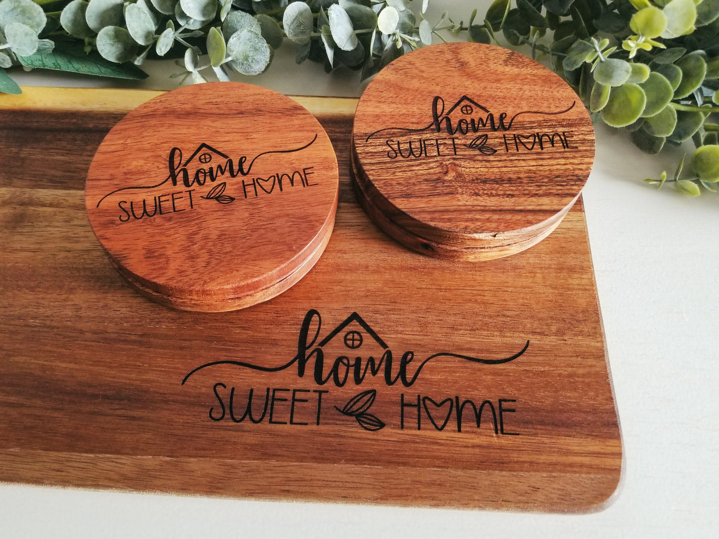 Acacia Wood Cutting Board with set of 4 round matching coasters.  Home Sweet Home Acacia wooden engraved cutting board with 4 coasters.